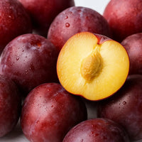 Thumbnail for Santa Rosa Plum Trees from Paradise Nursery with a halved Santa Rosa plum showing its interior.